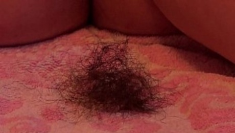 A fat girl shaves her hairy pussy and ass.