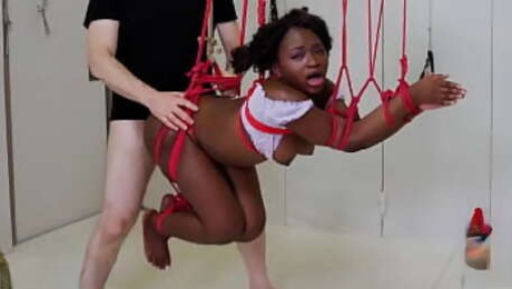 Beautiful black submissive gets gagged, tied up, ass punished, and turned into an anal compass to help her dominant conquer space - Noemie Bilas