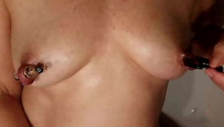 nippleringlover hot mom inserting big objects in extreme stretched nipple piercings