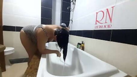 Shower. Voyeur camera. Nude Regina Noir in the shower washes her hair.