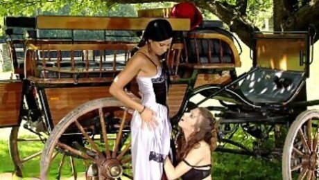 Classic p. lesbians Juliette and Ashley have fun by the wagon