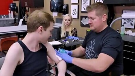 Natasha James stepson is nervous while doing his 1st tattoo so she help hin calm down by having sex with him while his artist is busy doing his ink.
