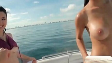 Two sexy girls enjoyed foursome action on speed boat