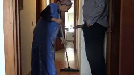 A Muslim cleaning maid is disturbed when she sees his big black cock