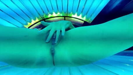 Trixie has fun in the tanning bed