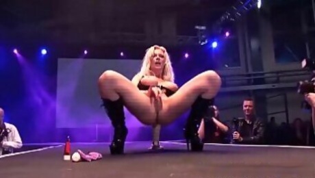 blonde big boob german milf toying on public stage