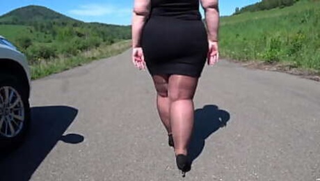 Mature BBW in nylon pantyhose and high heels walks down the public road Foot fetish Big booty ASMR