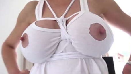 Lady Sonia has her tits bound while cleaning the house