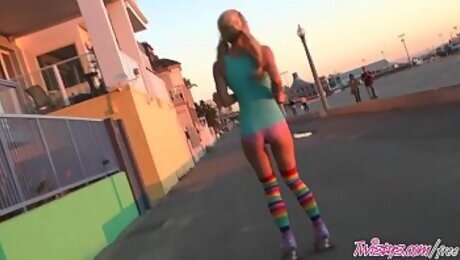 Roller teen (Heather Vandeven) shows off her pigtails and socks