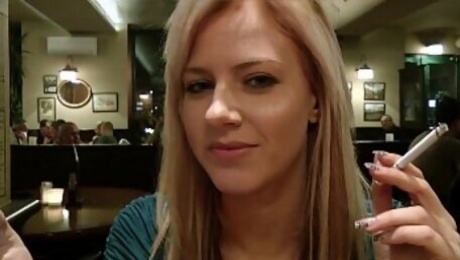 Blonde girl showing tits in the cafe