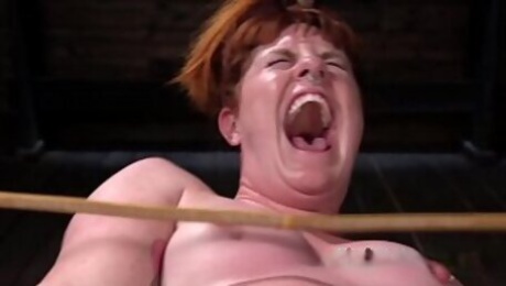 Bbw redhead slave in hogtie gets whipped