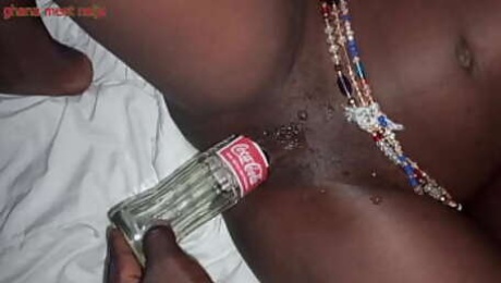 Playing with Ebony pussy and fucking it with coka cola bottle