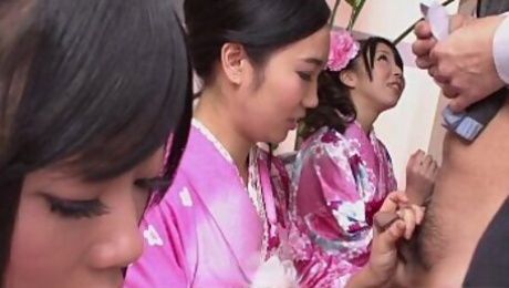 Three geishas sucking on one lonely cock