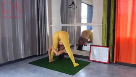 Regina Noir. Yoga in yellow tights doing yoga in the gym. 4