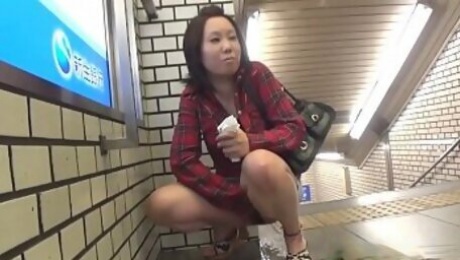 Asian ho pees in metro station