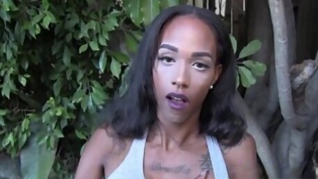 Young black tranny strips and masturbates