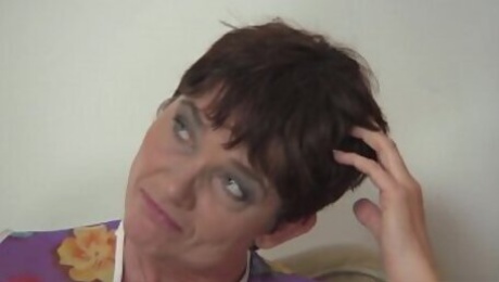 Hot 60 years old woman in stockings spreads legs