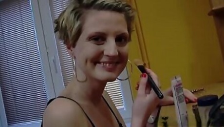 Desirable chick teases while putting on makeup