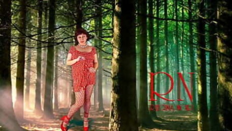 Pin-up lady posing in the forest. She shows her tits and pussy. Mesh tights. Regina Noir